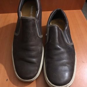Pair of black leather slip on shoes